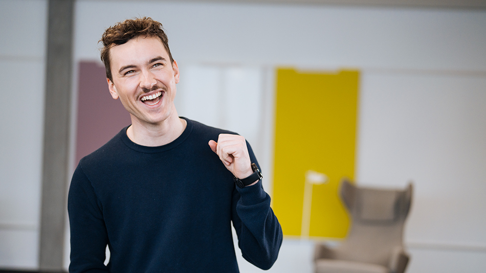 A person in the foreground cheers.