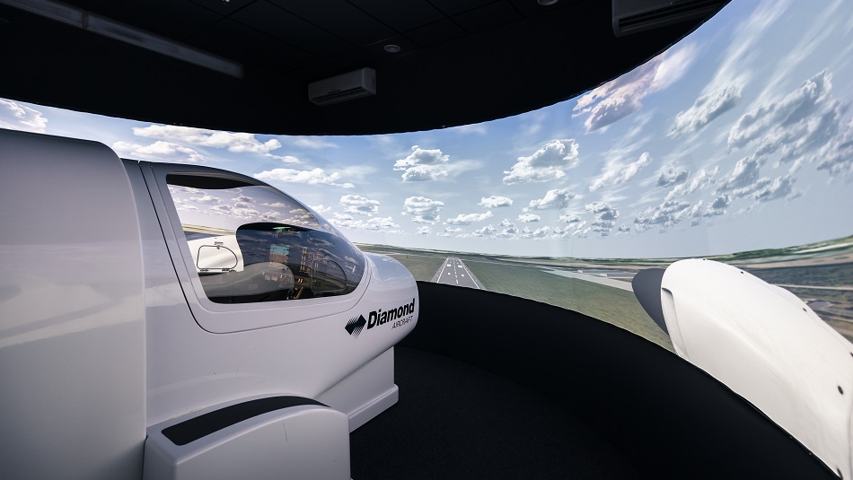 A student pilot sits in a simulator for a training aircraft